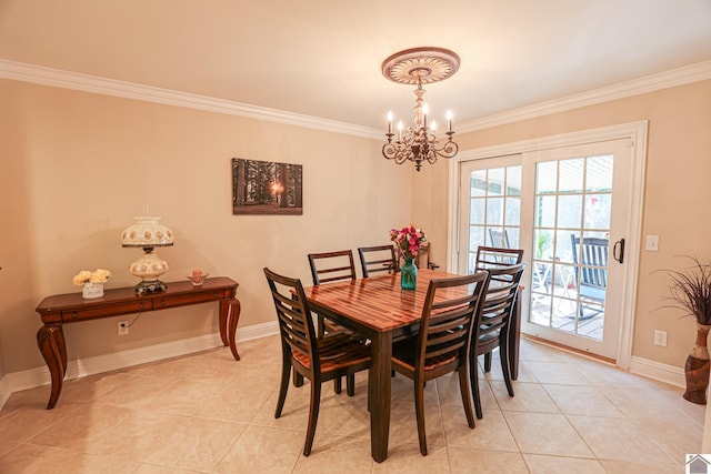 dining space with light tile patterned flooring, a chandelier, ornamental molding, and baseboards