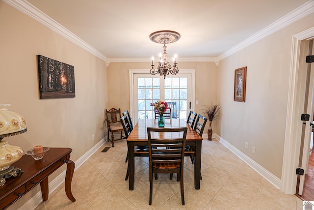 dining area with an inviting chandelier, light tile patterned floors, crown molding, and baseboards