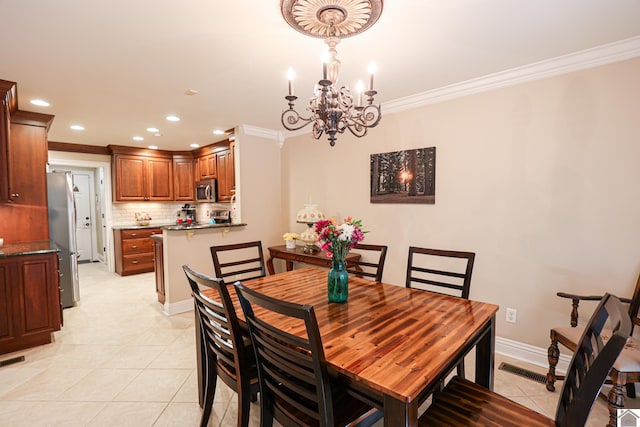 dining area featuring visible vents, light tile patterned flooring, recessed lighting, ornamental molding, and a notable chandelier