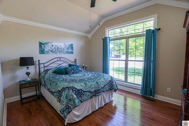 bedroom with dark wood-type flooring, baseboards, multiple windows, and lofted ceiling
