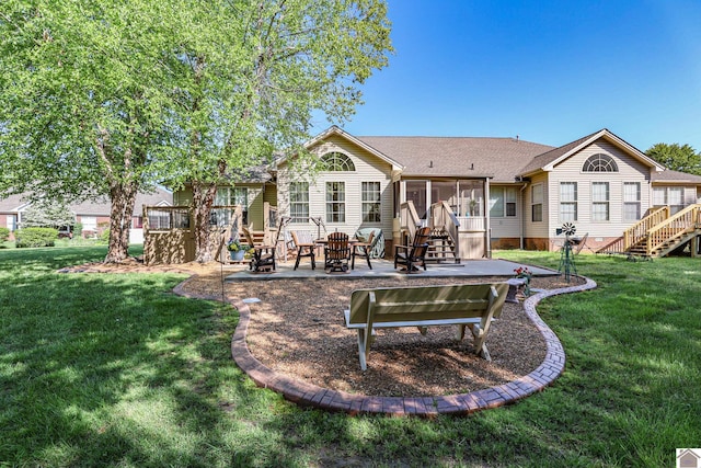 back of house with stairway, a fire pit, a patio area, and a sunroom