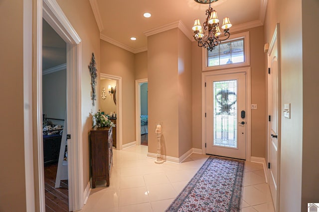 entryway with recessed lighting, a chandelier, ornamental molding, baseboards, and light tile patterned flooring