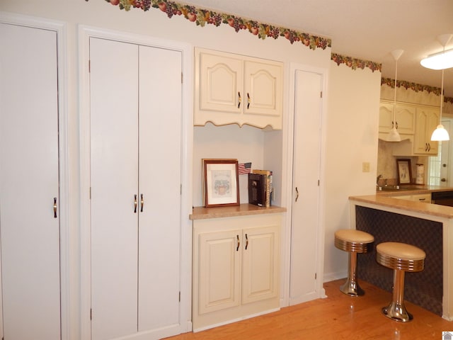 interior space featuring light wood-style floors, light countertops, and a sink