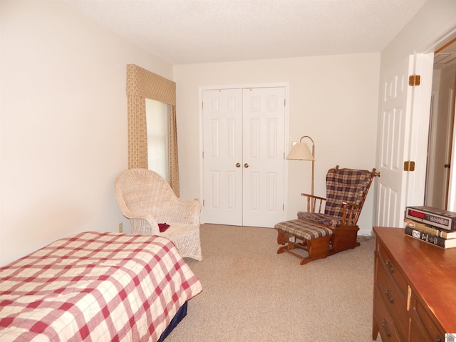 bedroom featuring a closet and carpet
