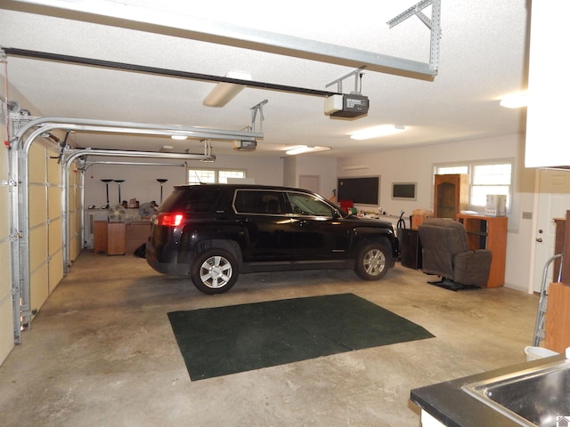 garage featuring a garage door opener