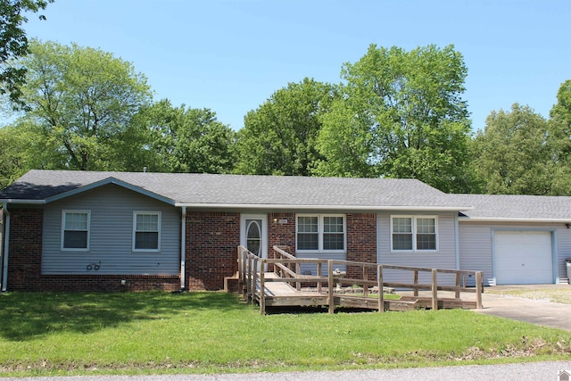 1725 Evelyn Dr, Paducah, KY 42003 - ranch-style house with an attached garage, a front yard, driveway, a wooden deck, and brick siding