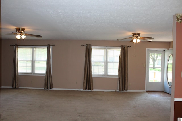 1725 Evelyn Dr, Paducah, KY 42003 - carpeted spare room with ceiling fan, healthy amount of natural light, a textured ceiling, and baseboards