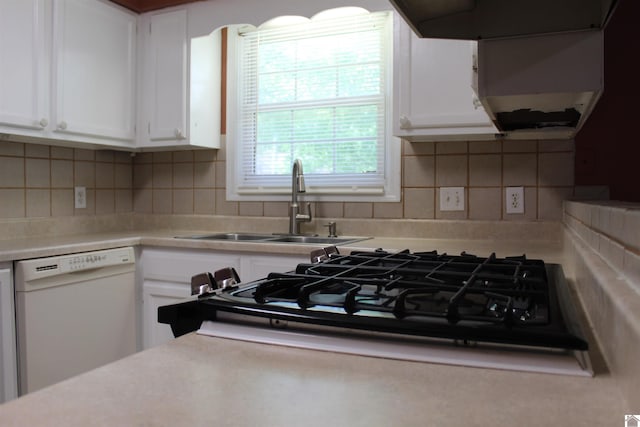 1725 Evelyn Dr, Paducah, KY 42003 - kitchen with white dishwasher, white cabinetry, light countertops, a sink, and decorative backsplash
