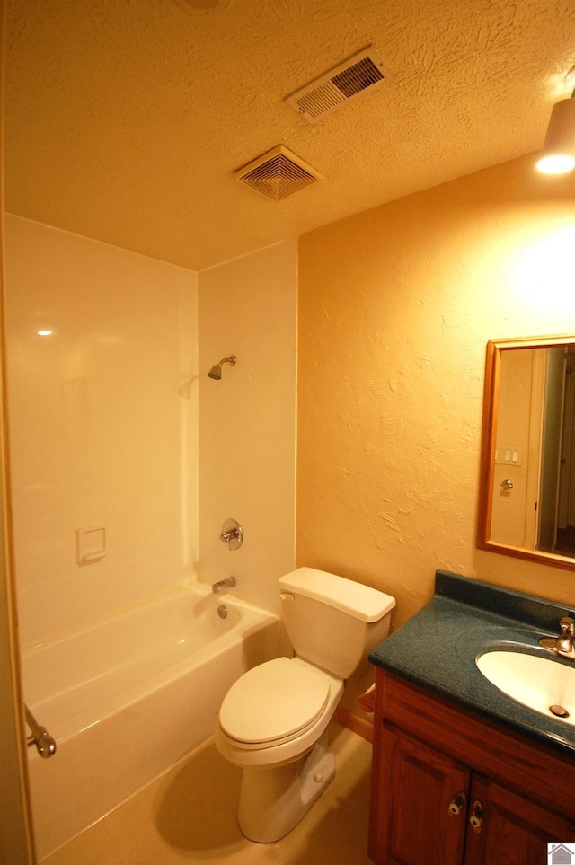 full bathroom featuring toilet, a textured ceiling, visible vents, and a textured wall