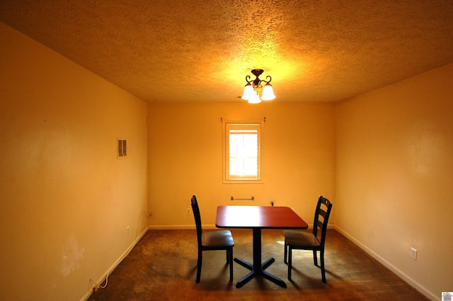 dining area with baseboards, carpet, a textured ceiling, and visible vents