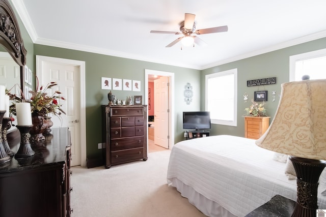 bedroom with connected bathroom, ceiling fan, ornamental molding, and light carpet