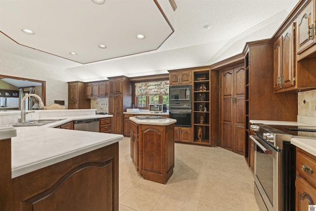 kitchen with a kitchen island, recessed lighting, tasteful backsplash, a sink, and black appliances