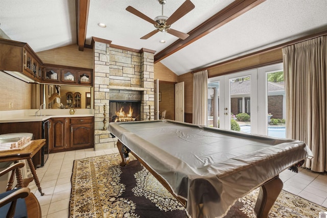 rec room with light tile patterned flooring, ceiling fan, vaulted ceiling with beams, french doors, and billiards