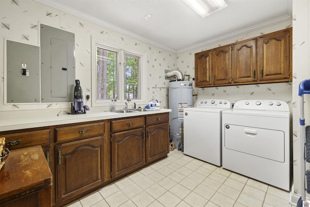 laundry room with ornamental molding, gas water heater, electric panel, separate washer and dryer, and cabinet space