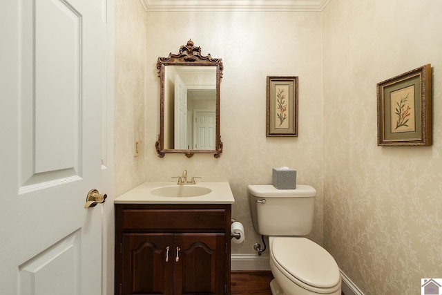 bathroom featuring toilet and vanity