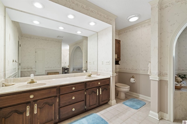 full bath with a sink, tile patterned floors, toilet, and wallpapered walls