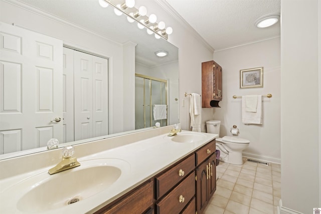 bathroom featuring visible vents, a stall shower, a sink, baseboards, and toilet