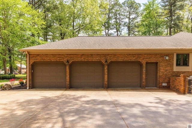 garage featuring driveway