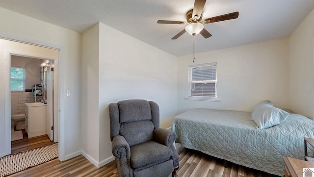 bedroom with baseboards, a ceiling fan, and wood finished floors