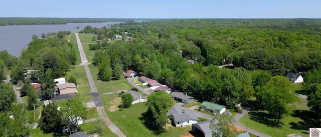 birds eye view of property featuring a residential view, a water view, and a forest view