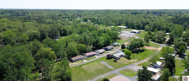 birds eye view of property with a wooded view