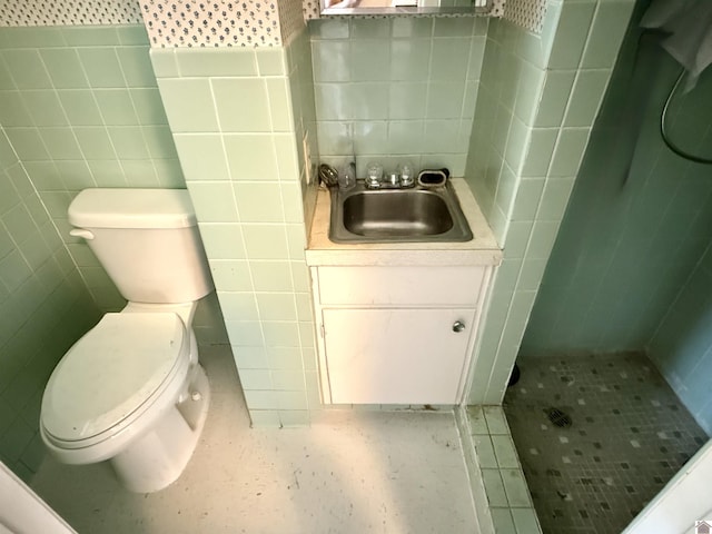 3458 Palma Rd, Calvert City, KY 42029 - bathroom with tile walls, a stall shower, toilet, and vanity