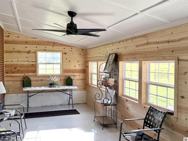 3458 Palma Rd, Calvert City, KY 42029 - living area featuring healthy amount of natural light, lofted ceiling, ceiling fan, wooden walls, and finished concrete floors