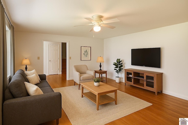 3458 Palma Rd, Calvert City, KY 42029 - living room featuring ceiling fan, baseboards, and wood finished floors