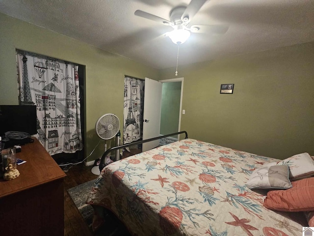 bedroom featuring a ceiling fan and wood finished floors