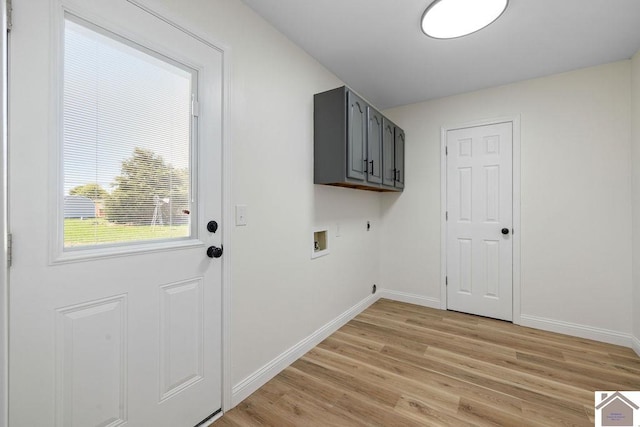 laundry area with cabinet space, light wood-style floors, hookup for a washing machine, baseboards, and hookup for an electric dryer