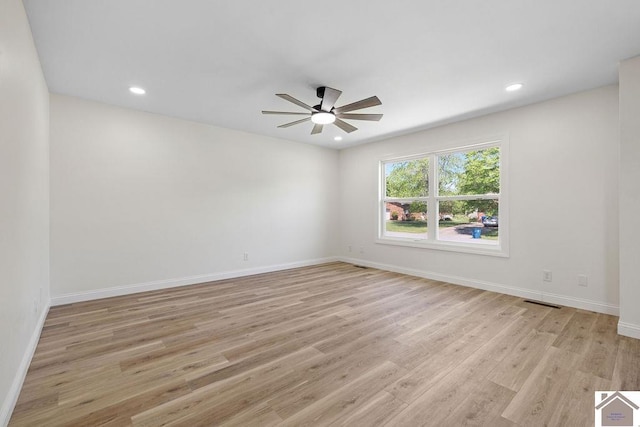 empty room featuring recessed lighting, baseboards, ceiling fan, and light wood-type flooring