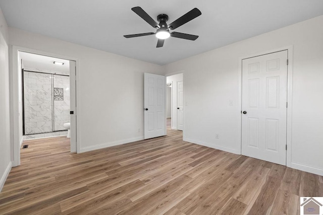 unfurnished bedroom with baseboards and light wood finished floors