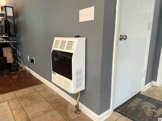 room details featuring baseboards and heating unit