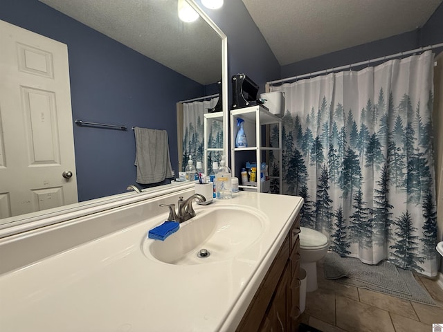 full bath featuring vanity, toilet, a shower with shower curtain, a textured ceiling, and tile patterned floors