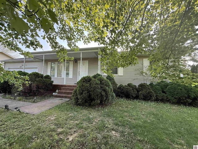 ranch-style home with covered porch and a front lawn