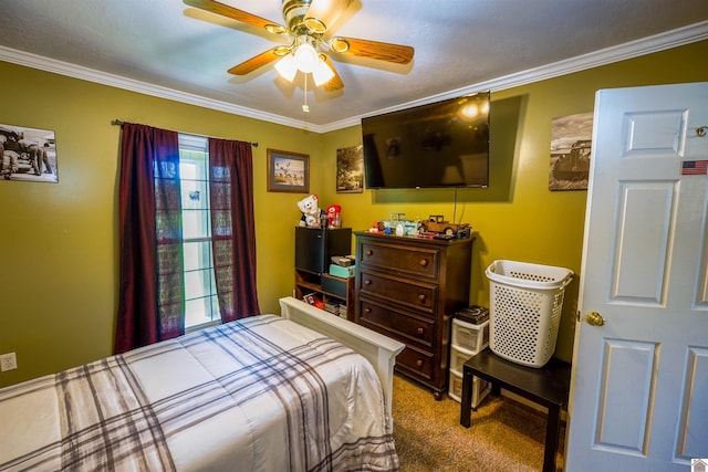 bedroom featuring a ceiling fan, ornamental molding, and carpet