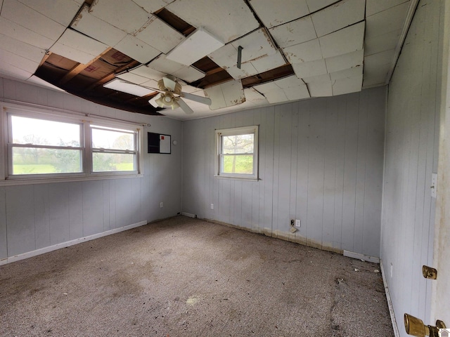 empty room with carpet floors and ceiling fan