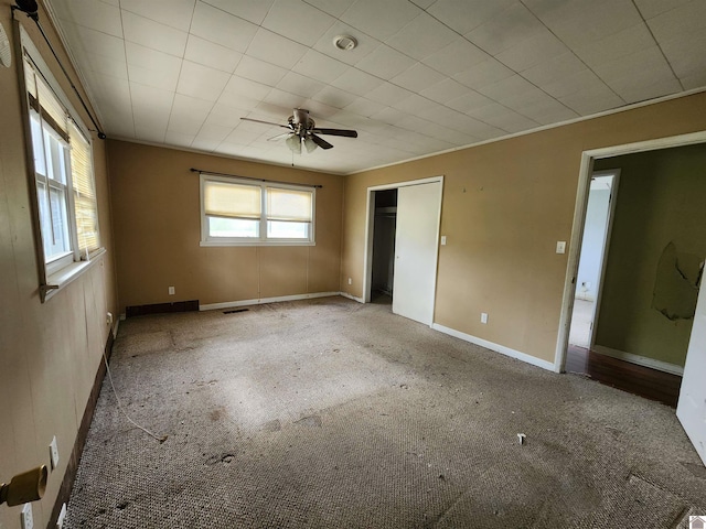 unfurnished bedroom featuring a closet, baseboards, carpet flooring, and visible vents