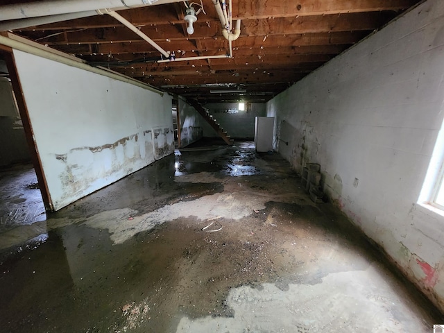 unfinished basement with stairs