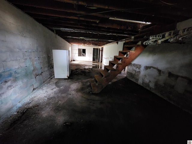 unfinished basement with stairs