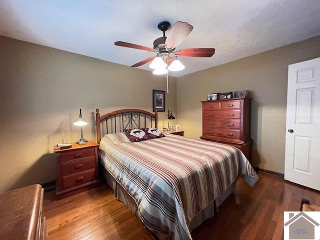 bedroom featuring ceiling fan and wood finished floors