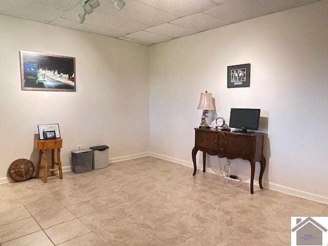office featuring baseboards and light tile patterned floors