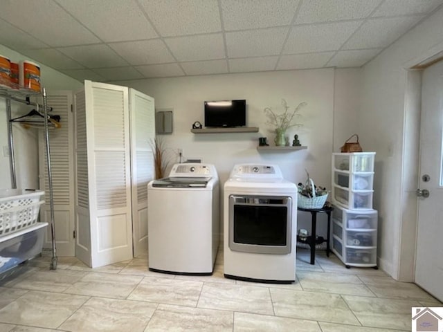 clothes washing area with laundry area and separate washer and dryer