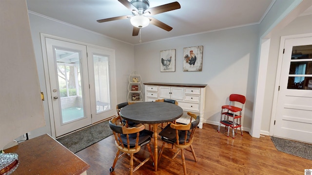 608 E 12th St, Benton, KY 42025 - dining area featuring a ceiling fan, baseboards, ornamental molding, and light wood-style floors