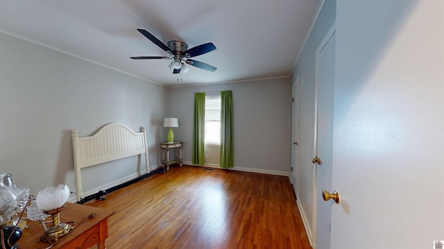 608 E 12th St, Benton, KY 42025 - bedroom featuring ceiling fan, visible vents, wood finished floors, baseboards, and ornamental molding