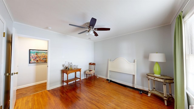 608 E 12th St, Benton, KY 42025 - interior space featuring baseboards, crown molding, wood finished floors, and ceiling fan