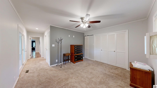 608 E 12th St, Benton, KY 42025 - carpeted bedroom featuring multiple closets, a ceiling fan, baseboards, visible vents, and ornamental molding