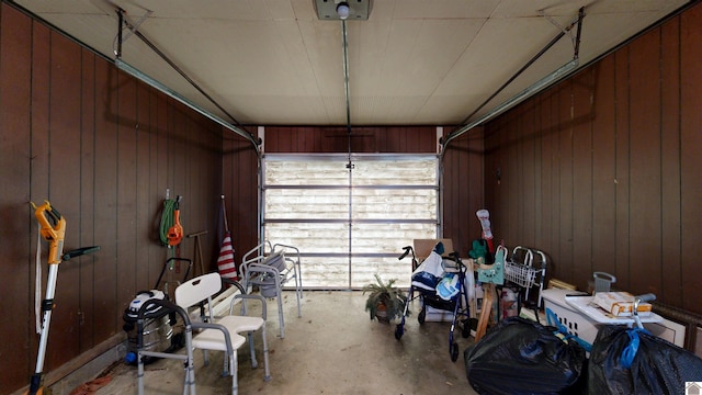 608 E 12th St, Benton, KY 42025 - garage with a garage door opener and wood walls