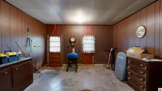 608 E 12th St, Benton, KY 42025 - miscellaneous room featuring wood walls and unfinished concrete flooring