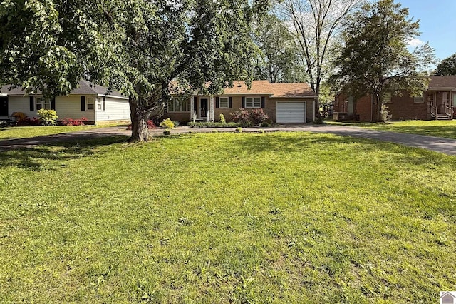 608 E 12th St, Benton, KY 42025 - ranch-style house with an attached garage, a front lawn, and aphalt driveway